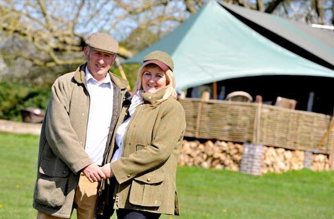 Meet your two Dandelion Hideaway luxury Glamping hosts: John and Sharon.